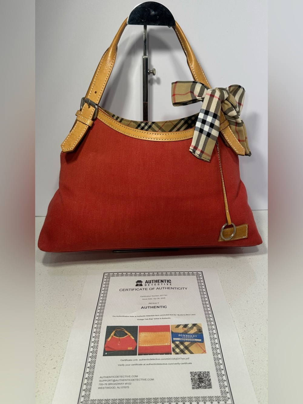 Burberry Blue Label red canvas and leather hobo-style shoulder bag. COA included